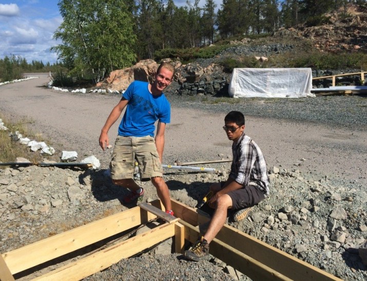 Sebastien and Douglas work on a new garage at the Retreat Center.