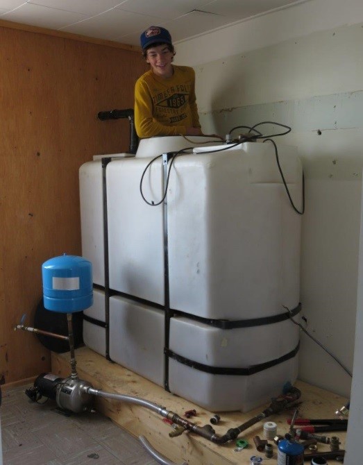 Matthias Steiner checks out the ‘fit’ of the water tank for the residence.